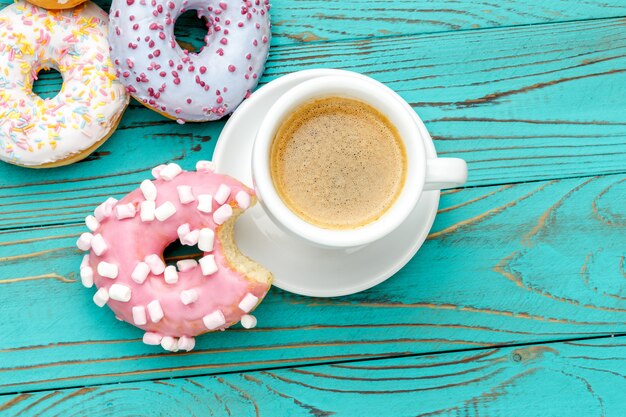 Donuts on colorful wooden table