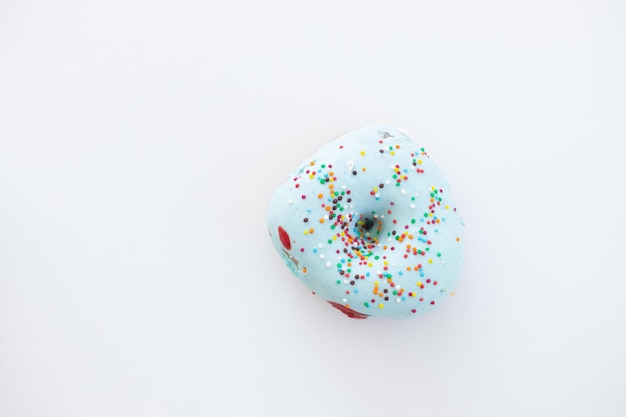 Donuts decorated with colorful sprinkles isolated on white background Flat lay Top view