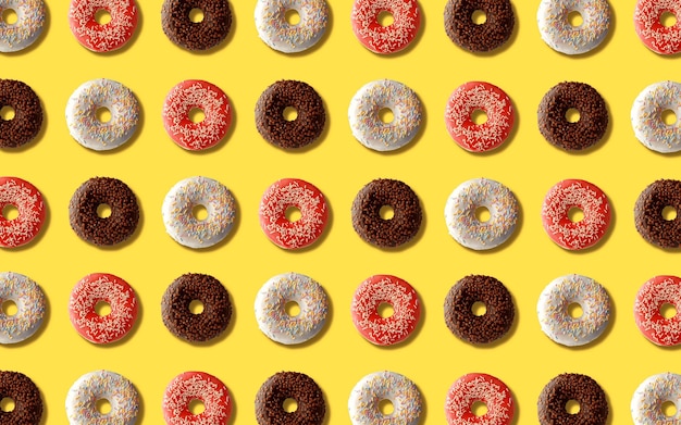 Donuts patroon drie soorten donuts op een gele achtergrond