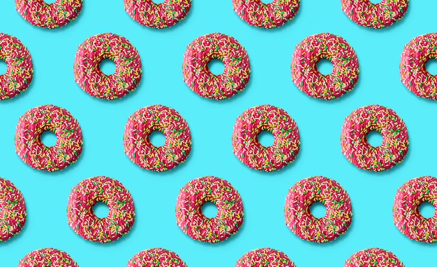 Donuts pattern on a mint cyan background. Top view. Flat lay. Summer concept