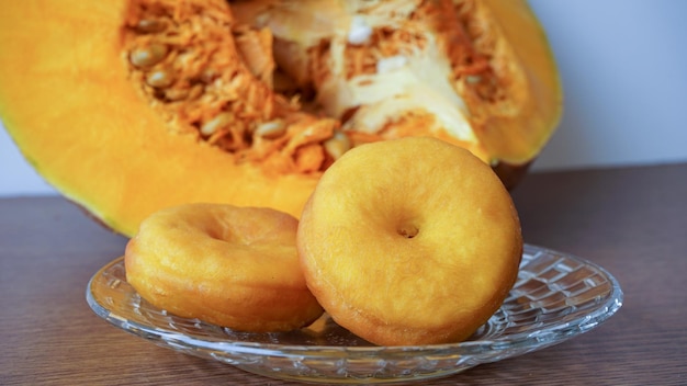 Donuts on a plate and pumpkin