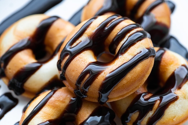 Donuts with chocolate food background closeup selective focus