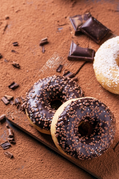 Donuts with cocoa powder and chocolate