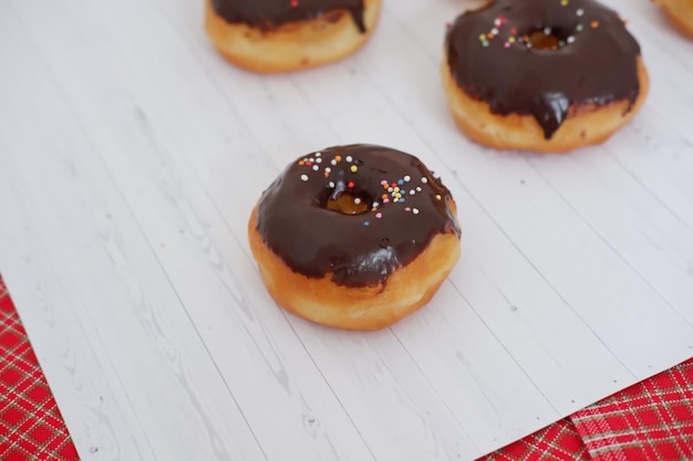 donuts with delicious chocolate coating as a background