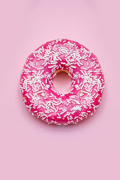 Donuts with icing on pastel pink background. Sweet donuts. soft focus