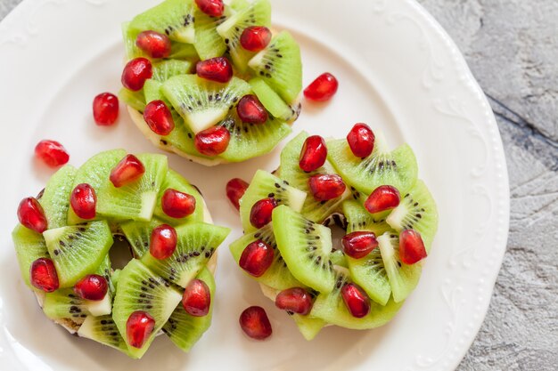 Donuts with kiwi and pomegranate