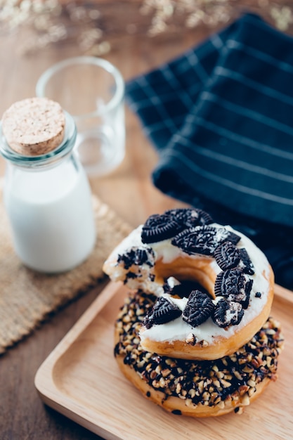 donuts with milk on wooden table