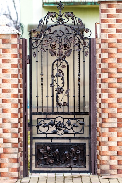 Door decoration with ornate wrought-iron elements, close up.