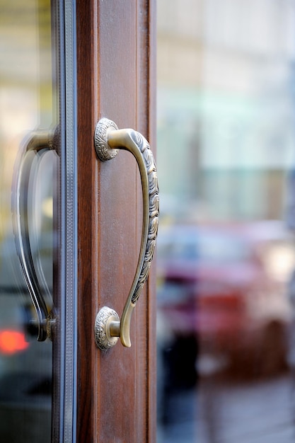 Door handle. Detail of wooden door