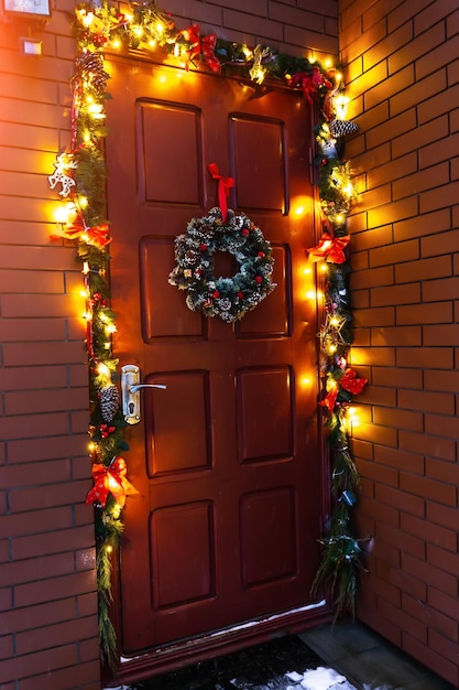 The door of the house decorated with a Christmas wreath