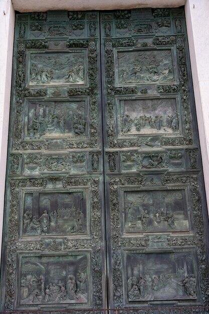 The door is made of metal and has a lot of designs on it