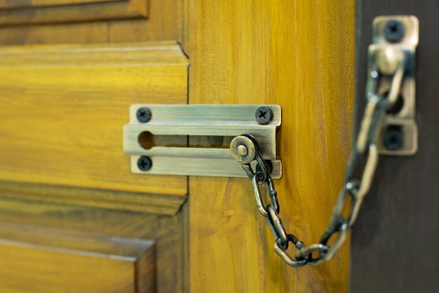 Photo door lock chain lock on wooden door