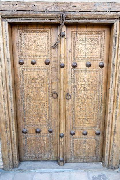 A door locked with a chain in an old building