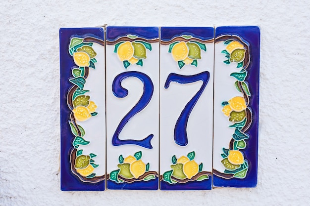 Door number 27 twenty seven conceptual image closeup.