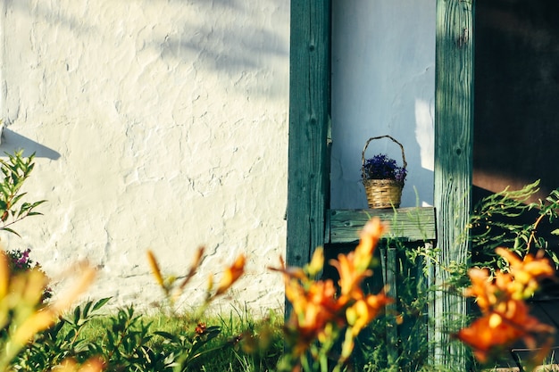 Door with flowers in front