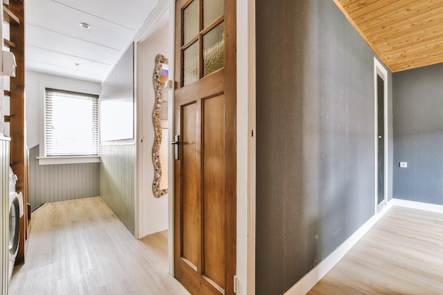 Doorway of modern apartment with white walls and parquet floor