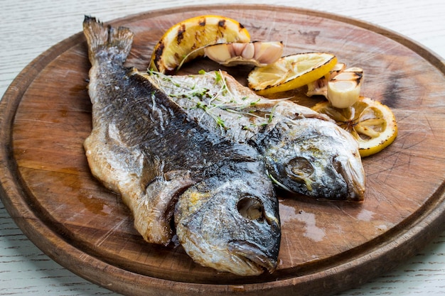 Dorado fillet on a wooden board