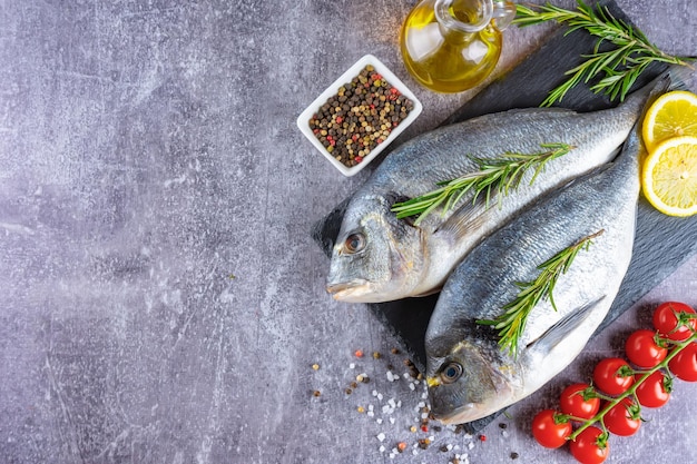 Dorado fish on gray concrete background with copy space Natural food ingredients