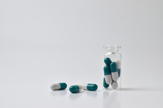 A dose of pills on a white background. Medical preparations.