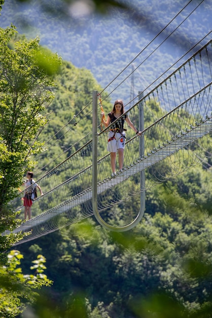 Dossena Italy 2022 Iron sun bridge suspended in the void to cross the valley on foot