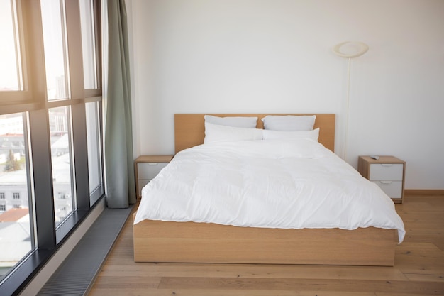 double bed in a hotel with a panoramic window