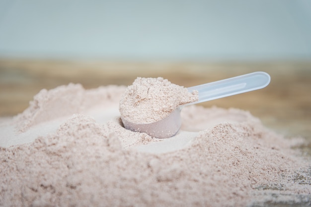 Double chocolate whey protein powder scoop nutrition healthy\
food bodybuilding.