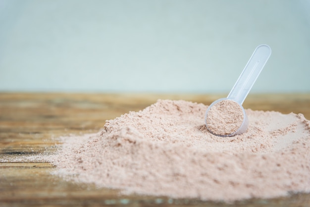 Double chocolate whey protein powder scoop nutrition healthy\
food bodybuilding.