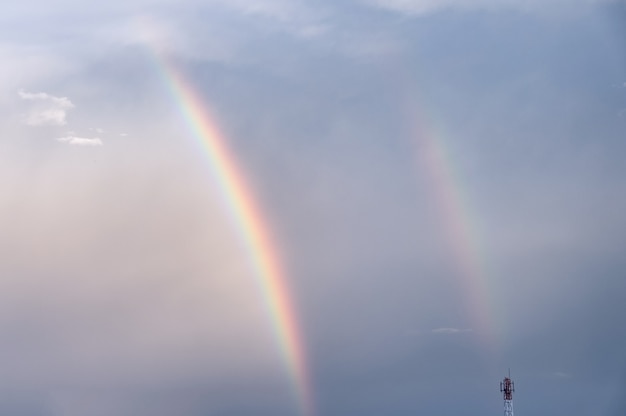 Double colorful rainbow in sky