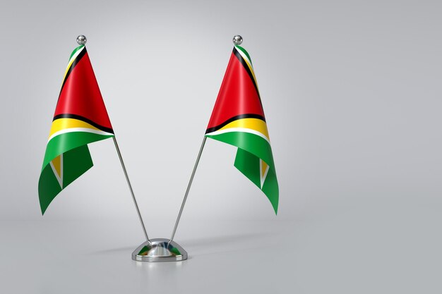 Photo double cooperative republic of guyana table flag on gray background 3d rendering