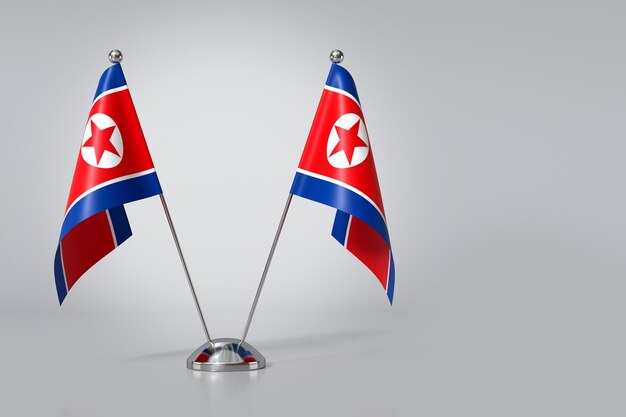 Double Democratic Peoples Republic of Korea Table Flag on Gray Background 3d Rendering