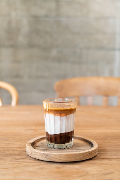 double dirty coffee cup (espresso coffee with milk and chocolate) in coffee shop cafe