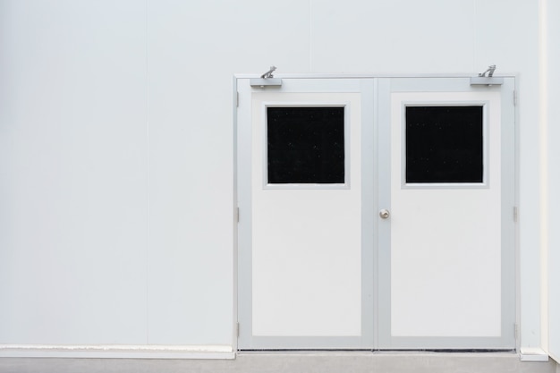 Double door in control room for pharmaceutical or food industry and concrete floor