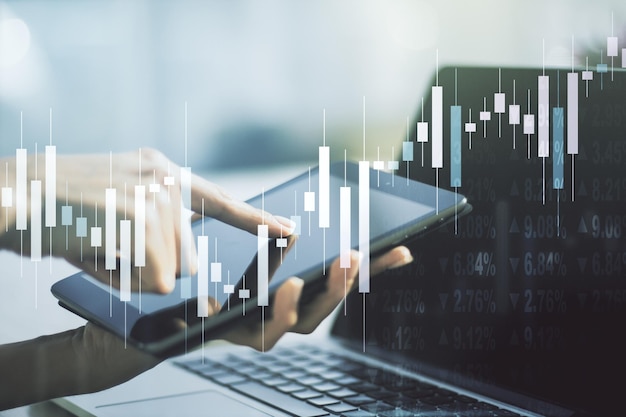 Double exposure of abstract creative financial diagram with finger clicks on a digital tablet on background banking and accounting concept