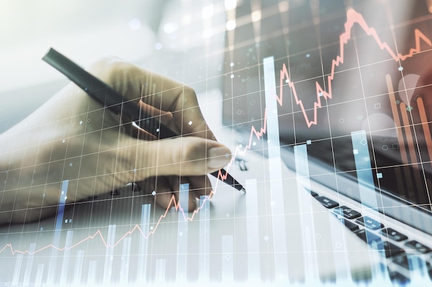 Double exposure of abstract creative financial diagram with hand writing in notebook on background banking and accounting concept