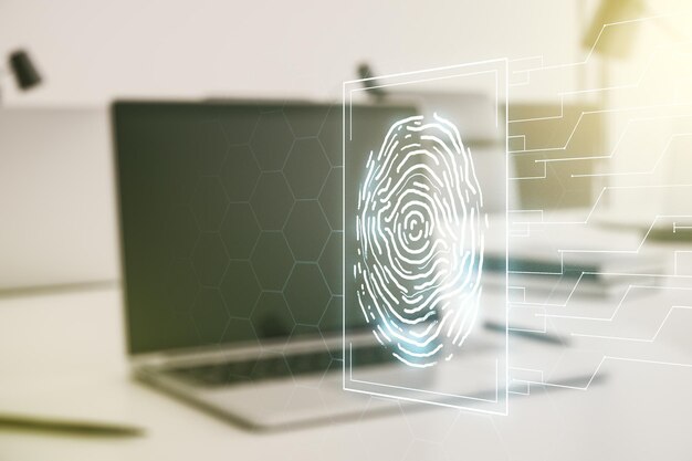 Double exposure of abstract creative fingerprint hologram on computer background protection of personal information concept