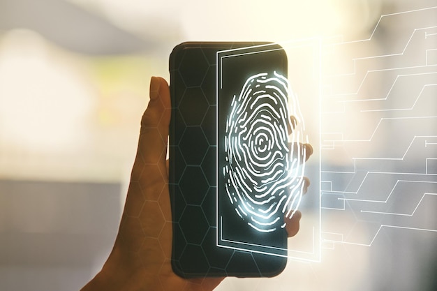 Photo double exposure of abstract creative fingerprint hologram and hand with cellphone on background protection of personal information concept