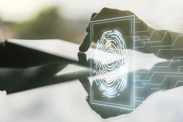 Double exposure of abstract creative fingerprint hologram with finger clicks on a digital tablet on background protection of personal information concept