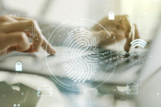 Double exposure of abstract creative fingerprint hologram with\
hands typing on laptop on background protection of personal\
information concept