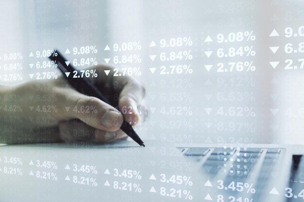 Double exposure of abstract creative statistics data hologram\
with hand writing in notebook on background with laptop statistics\
and analytics concept