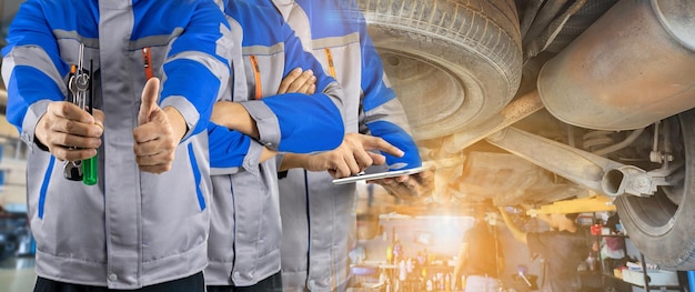 Double Exposure Auto mechanic team in the auto service center car