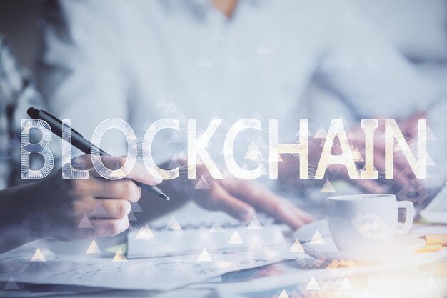 Double exposure of blockchain theme drawing over people taking notes background Concept of cryptocurrency