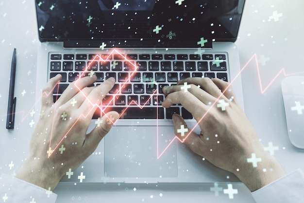 Photo double exposure of creative abstract heart rate hologram and hands typing on laptop on background healthcare technolody concept