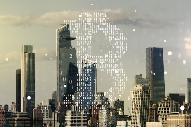 Double exposure of creative Bitcoin symbol hologram on New York city skyscrapers background Cryptocurrency concept