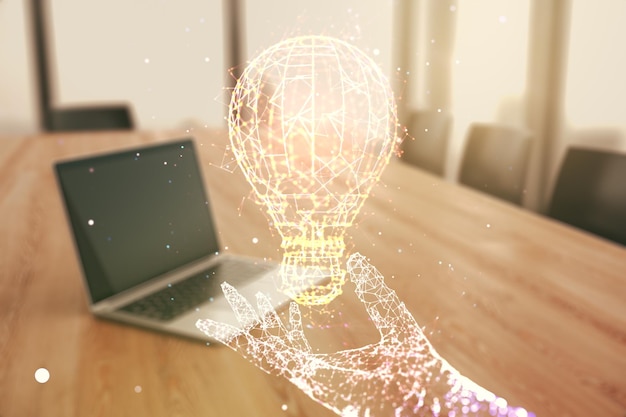 Photo double exposure of creative light bulb hologram on laptop background research and development concept