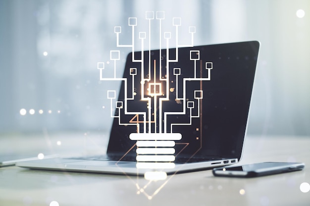 double exposure of creative light bulb hologram with chip on laptop background idea and brainstorming concept