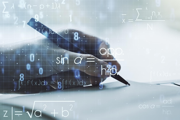 Double exposure of creative scientific formula concept with man\
hand writing in notebook on background research and development\
concept