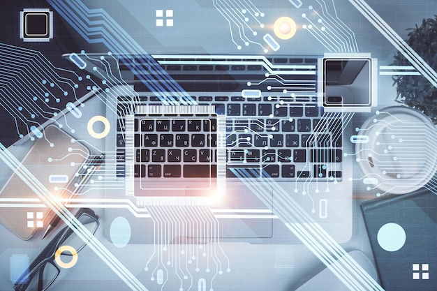 Double exposure of data theme drawing hologram over topview work table background with computer Concept of technology