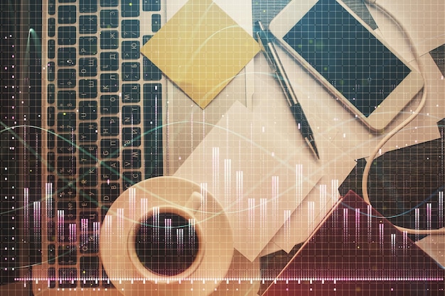 Double exposure of financial chart drawing over table background with computer Concept of research and analysis Top view