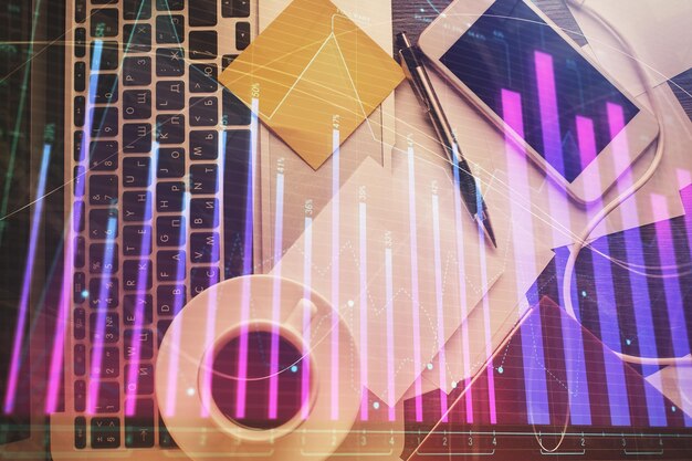 double exposure of financial chart drawing over table background with computer concept of research and analysis top view
