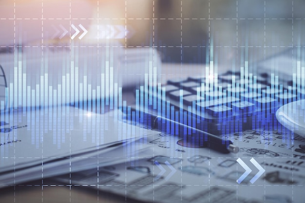 Double exposure of financial chart drawings and desk with open notebook background Concept of forex market